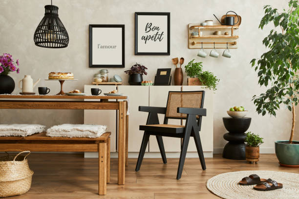 istock Creative and modern dining room interior design with mock up poster frames, family dining table, bench and chair and retro inspired personal accessories and decorations. Template. 