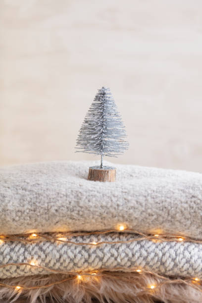 istock Christmas little trees and golden lights bokeh. 1369932909