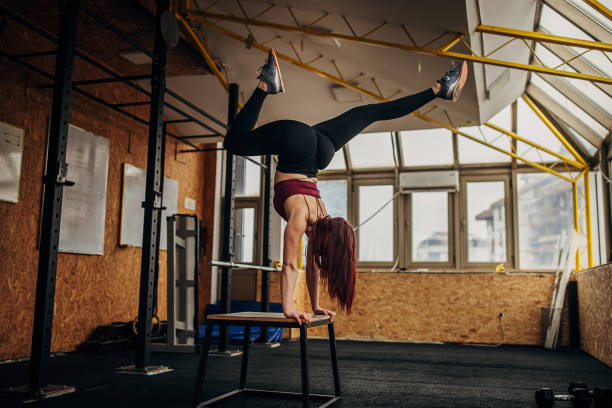 istock Fit woman exercising in gym 1369933096