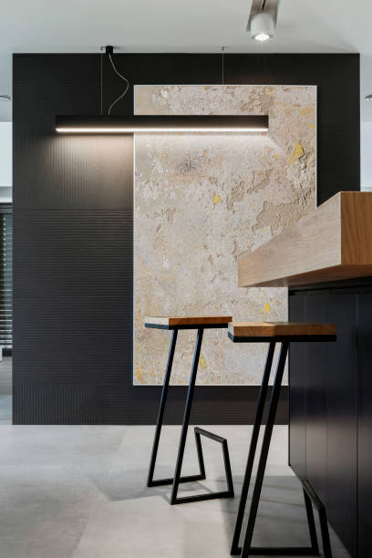 istock Elegant modern kitchen interior with kitchen island, bar stools and creative wall decoration. Mock up frame. Geometric forms and shapes. Details. Template. 1369933294