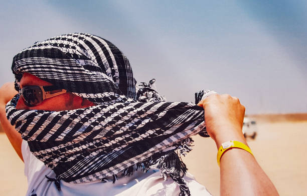 Tuareg with camel on the western part of The Sahara Desert in Morocco. The Sahara Desert is the world's largest hot desert.