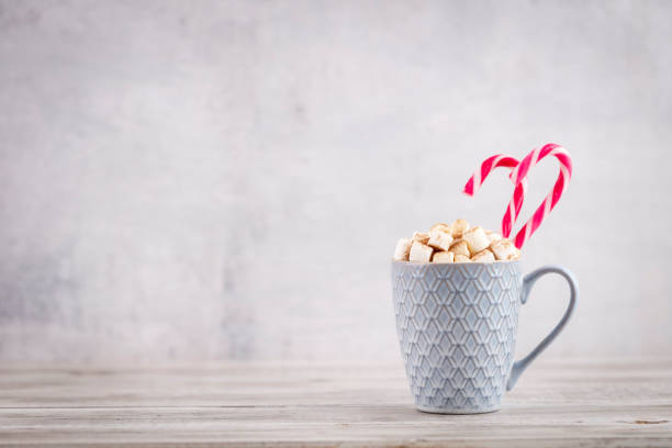 istock Christmas candy cane cozy background. 1369933365