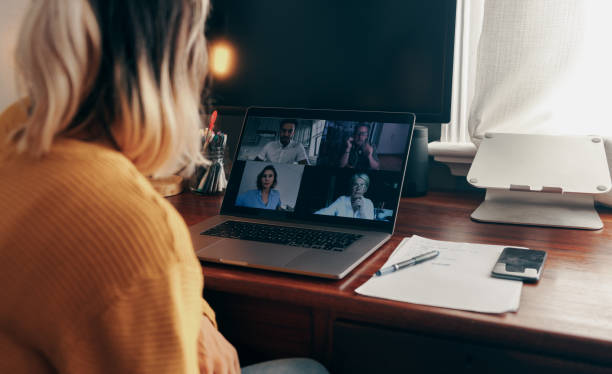 istock Businesswoman attending a virtual meeting while working from home 1369934341