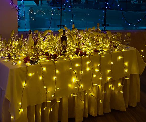 istock Party table decorated with fairy lights 1369934979