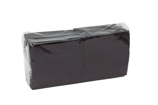 istock Black paper napkins in a package on a white background 1369937716