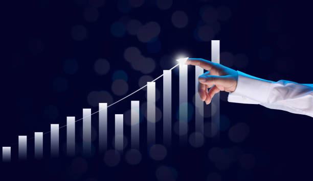 istock holographic graph with growing indicators and a woman's hand. Business growth concept, profitable startup, profitable business strategy 1369938448