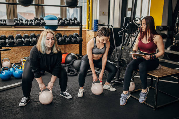 istock Fitness trainer training women 1369938882