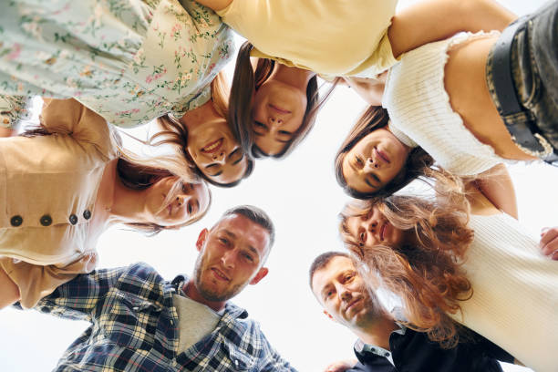 istock View from below of young positive people that looking down 1369939145
