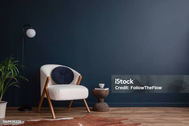 Stylish Compositon Of Elegant Living Room Interior Design With Fluffy Armchair And Modern Home Accessories Blue Wall Home Staging Template Copy Space Stock Photo - Download Image Now