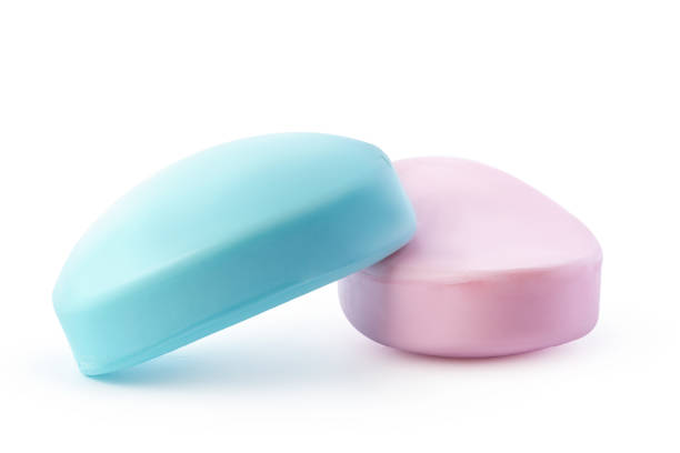 istock Pink and blue soap bars on white background 1369939368