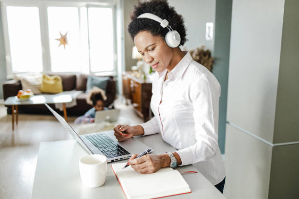 istock Single African American mother is working from home 1369942005