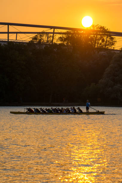 Dragon boat on lake in Hannover during sundown stock photo