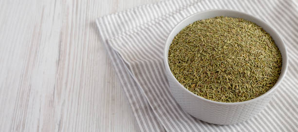 istock Organic Dried Rosemary in a Bowl, side view. Space for text. 1369943480