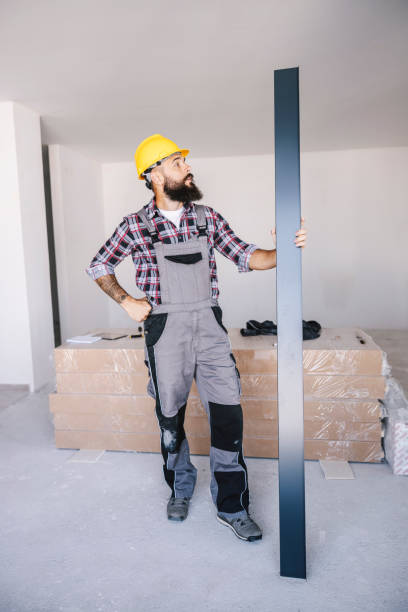 istock A handyman holding metal bar as a construction material at his workplace. 1369944704