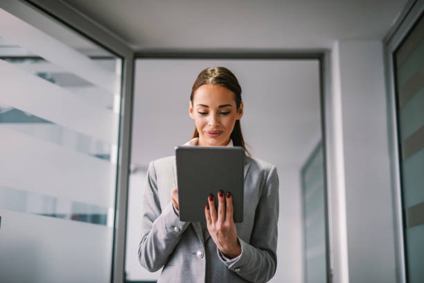 istock A businesswoman working on tablet at office. 1369946042