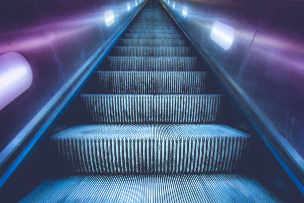 Escalator in up direction stock photo