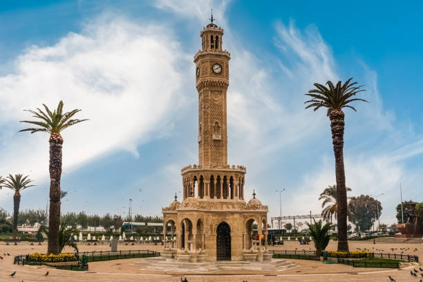 Izmir Clock Tower in Konak square. Famous place. Clock Tower, Izmir, Monument, Tower, Famous Place, City Life, Palm Tree, City Life, Backgrounds clock tower stock pictures, royalty-free photos & images