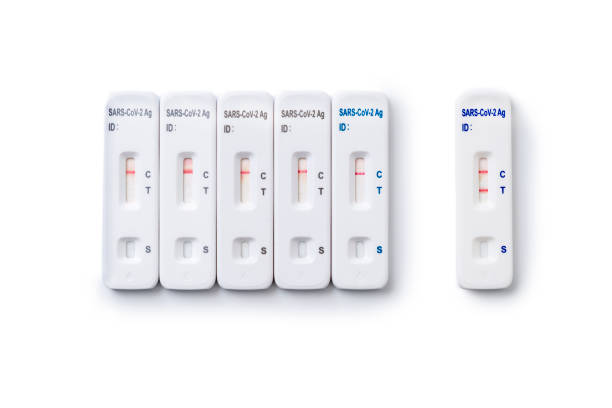 istock Multible Tests for coronavirus on an white background. One positive 1369956447
