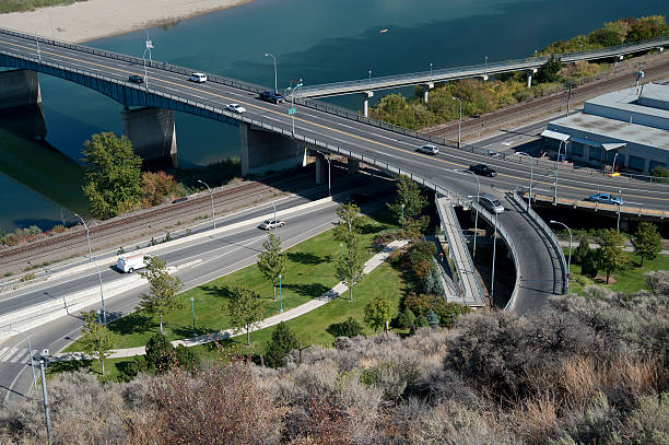 Highway bridge and river in Kamloops Intersection and bridge near Kamloops, British Columbia, Canada kamloops stock pictures, royalty-free photos & images