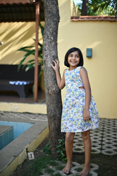 istock Girl collecting flowers from backyard 1369960279