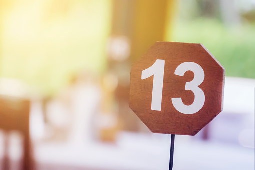13 - thirteen, the number of the table in the restaurant. unlucky or lucky number,
