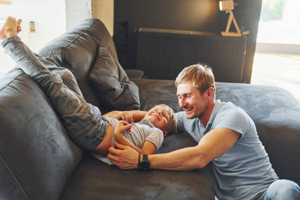 istock Having fun. Father and son is indoors at home together 1369960956
