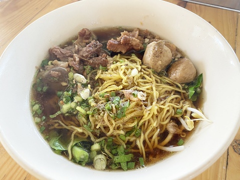 close up beef noodle on table