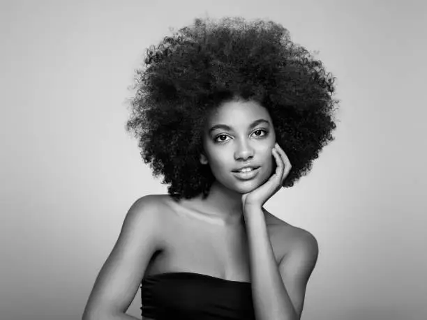 Photo of Beauty portrait of African American girl with afro hair