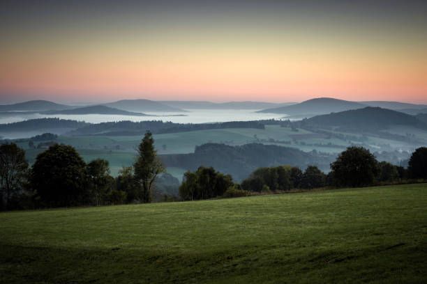 Fog at dawn in the Rhön. Near Poppenhausen, Hesse, Germany, Europe