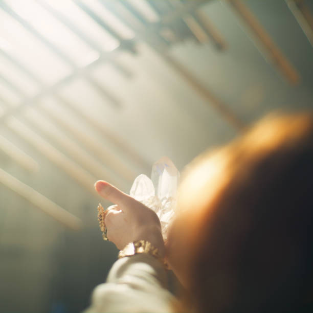 istock Magic ritual in desert tent. Woman's hand with a healing crystal. 1369962895