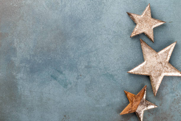 istock Christmas decoration. Christmas star on rustic dark background. 1369964345
