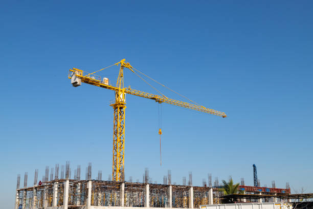istock Crane construction of building with blue sky 1369964901