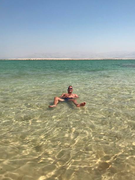 istock Floating in the Dead Sea. 1369966482