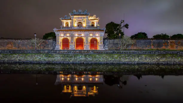 Hue city, Vietnam - 10th February, 2022: a night shot of Gate of Manifest Benevolence (Cửa Hiển Nhơn) at the Imperial citadel of Huế
