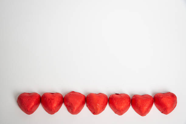 Chocolate Candy Red Heart Sweets for Valentine's Day on white background. Copy space