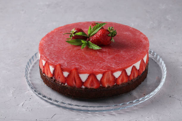 istock Cheesecake with strawberries and jelly without baking on light gray background. Closeup 1369972946