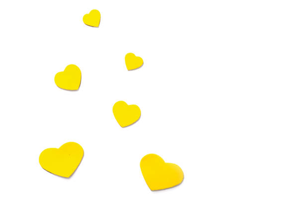istock Valentine's Day. Yellow hearts on a white background. Top view 1369973443