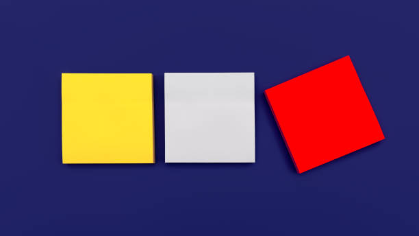 istock Three blank multi colored square stickers on dark blue background, top view. Blank space for future important events announcements 1369974404