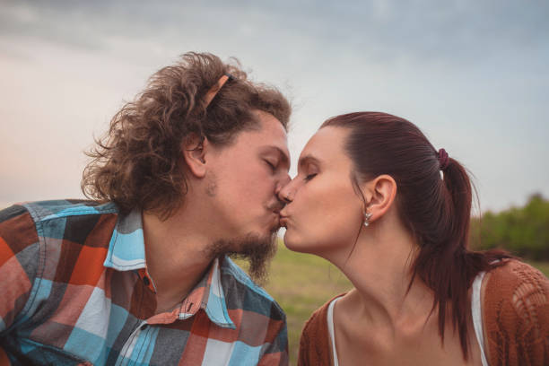 istock Cute young couple on the beach 1369975208