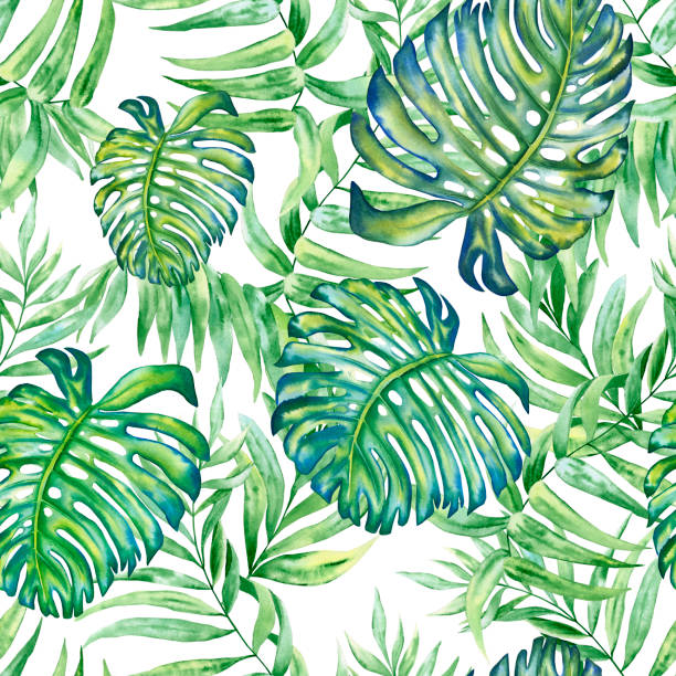 istock Tropical leaves seamless watercolor pattern. Hand drawn illustration of green plant branches isolated on white background. Jungle ornament. Summer print for clothes and wallpaper. Exotic background. 1369975980