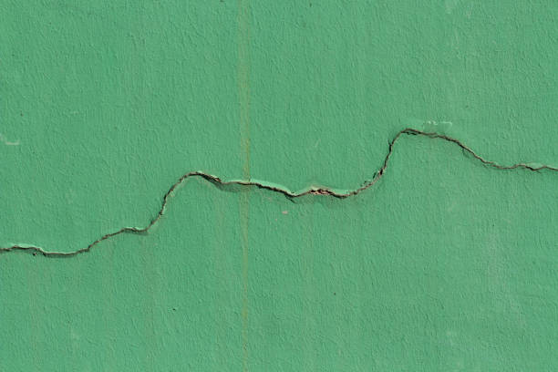 istock Trendy green color cracked background 1369978490