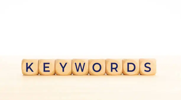Photo of Keywords word on wooden cube shape