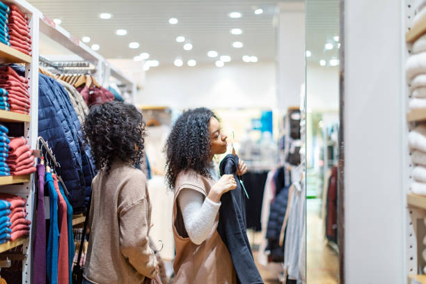 istock Two African women in shopping mall 1369985331