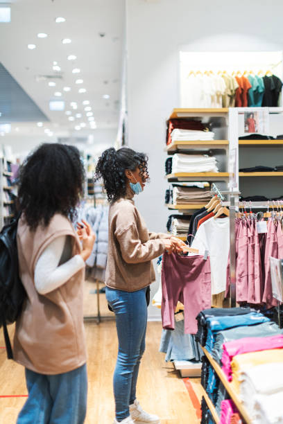 istock Two African women in shopping mall 1369985968