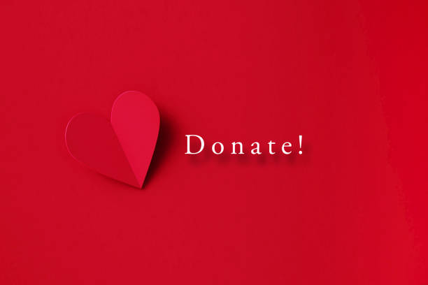 istock Donation Concept - Donate Message Next To A Folding Red Heart Shape Over Red Background 1369987933