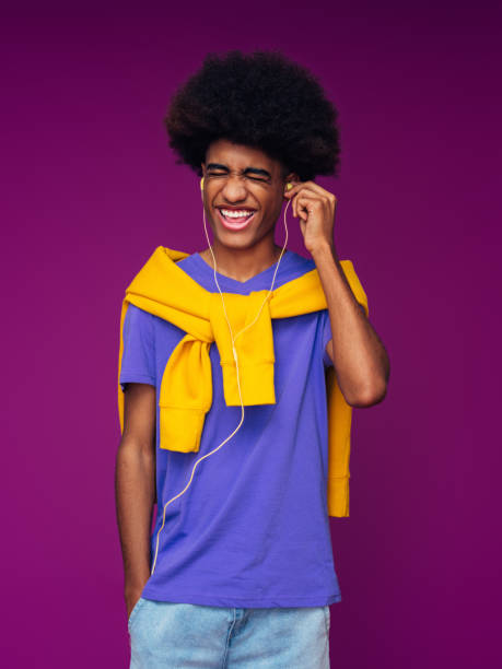 istock Portrait of funny afro guy using phone 1369988122