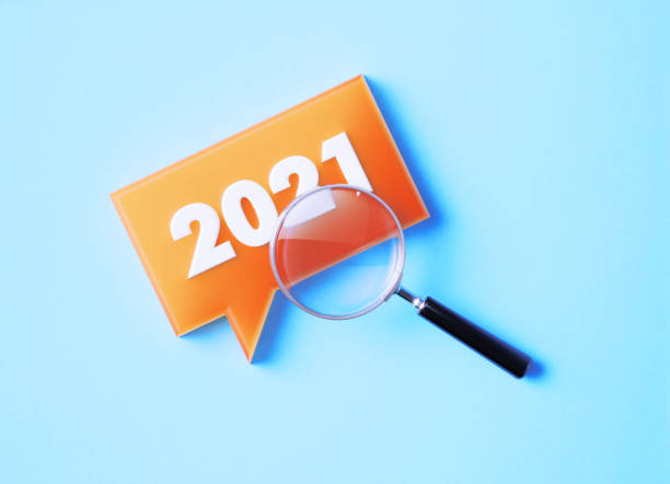 istock Magnifier And Speech Bubble With 2021 On Blue Background 1369989675