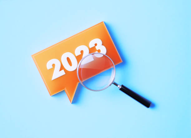 istock Magnifier And Speech Bubble With 2023 On Blue Background 1369989724