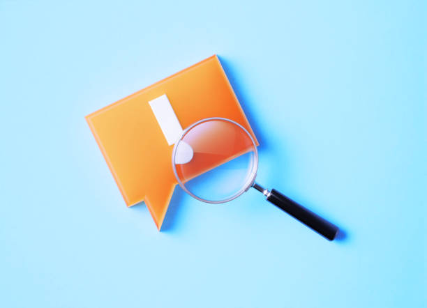 istock Magnifier And Speech Bubble With Exclamation Point On Blue Background 1369990093