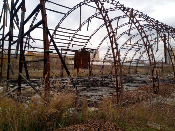 istock Burned hangar. frame of the hangar after the fire. everything burned down. 1369990872